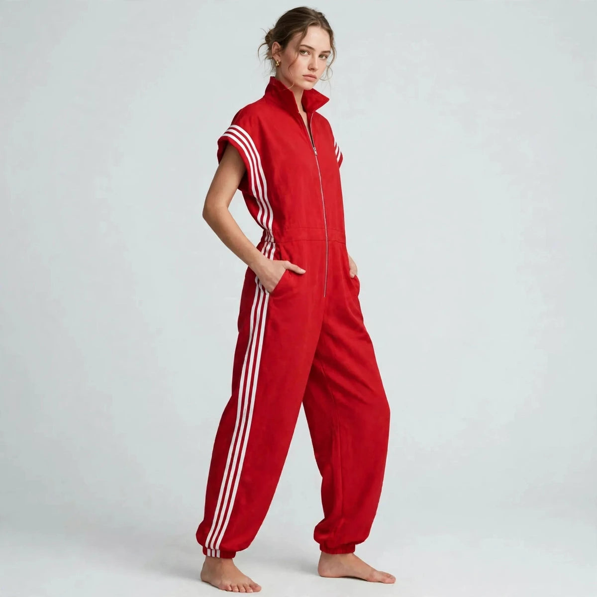 Women's red sporty striped jumpsuit, three-quarter view