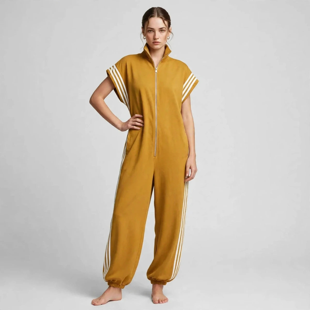 Woman wearing mustard yellow sporty stripe zip-front jumpsuit, front view