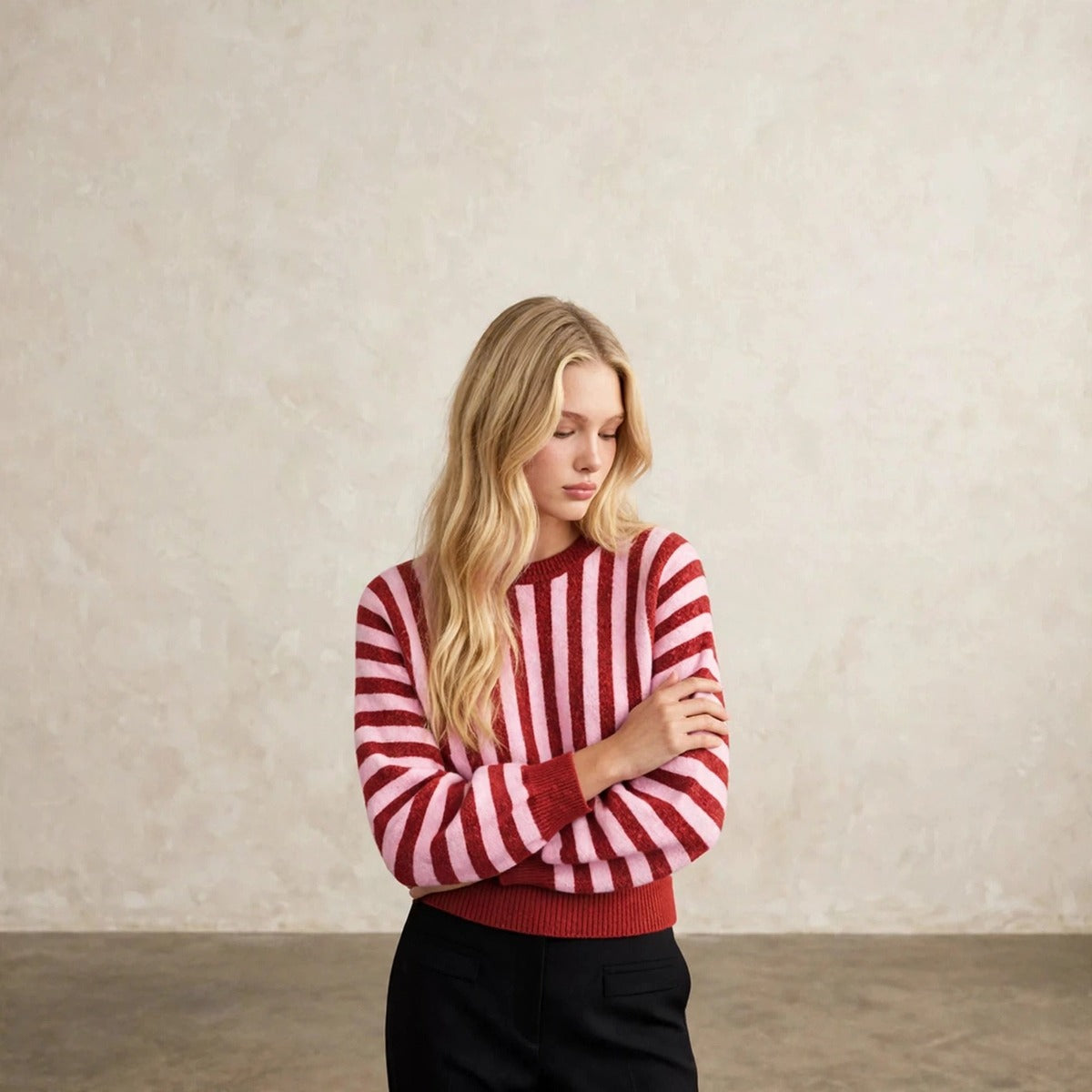 Women's deep red and pink vertical striped crew neck sweater, front view