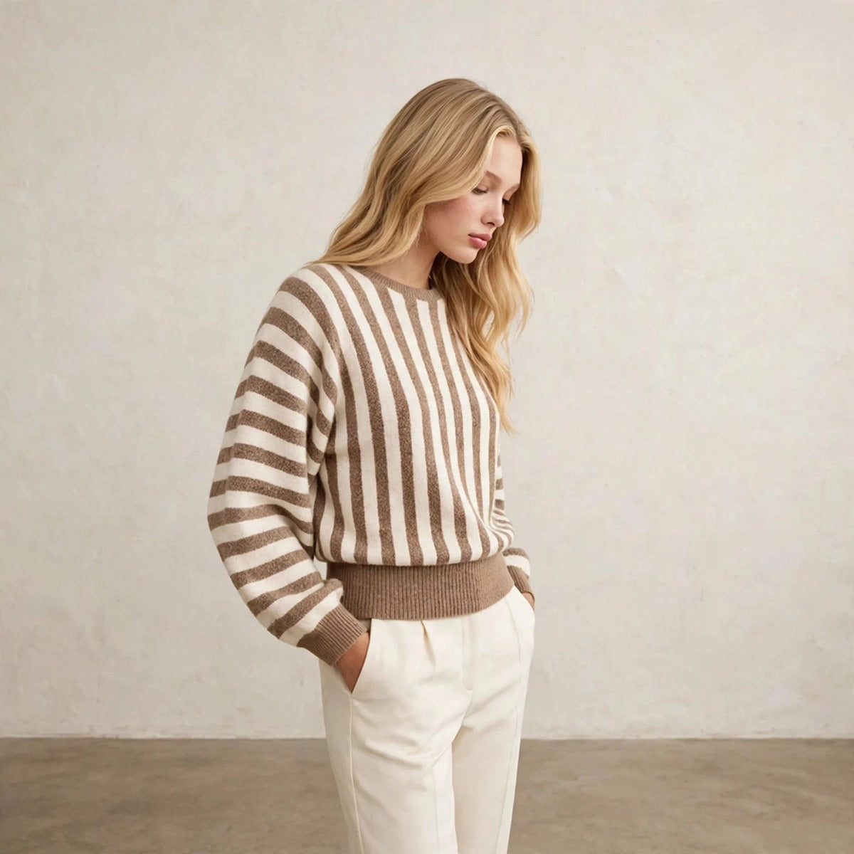 Women's khaki and cream striped sweater with balloon sleeves, side view