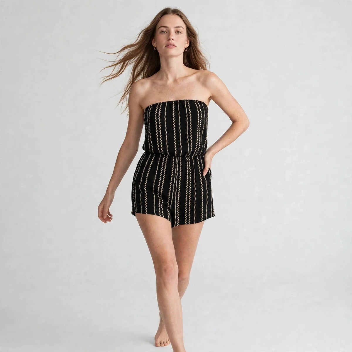 Women's black striped tube romper, three-quarter view