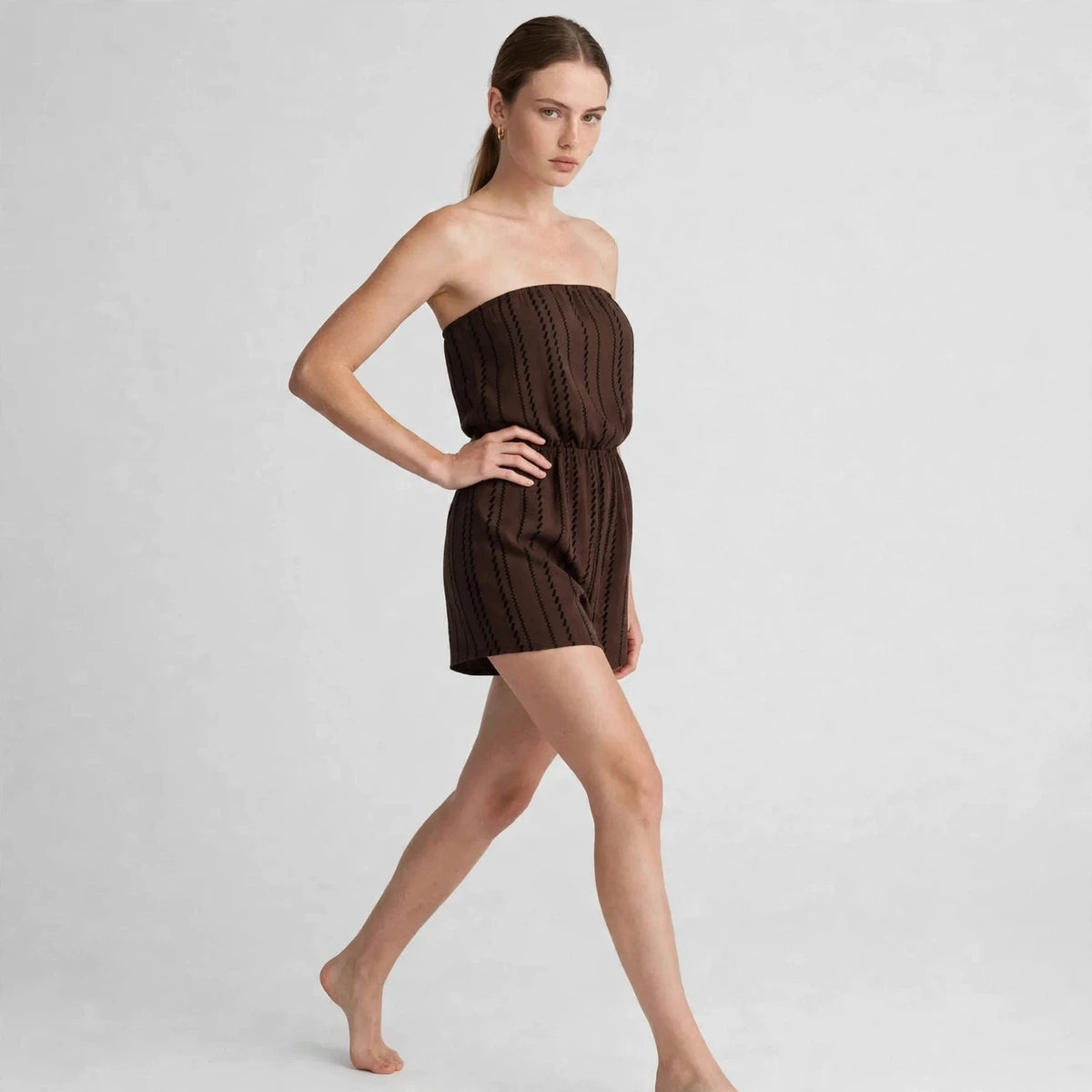 Women's dark brown striped tube romper, three-quarter view
