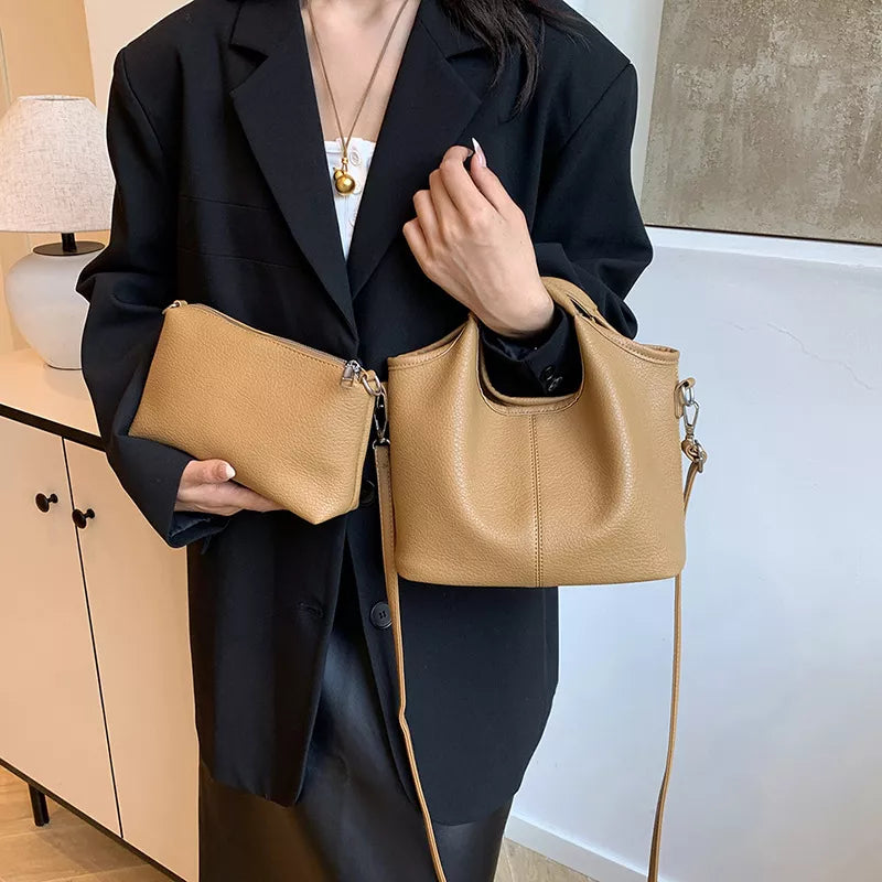 Textured leather crossbody bag with matching pouch detail | Orleve
