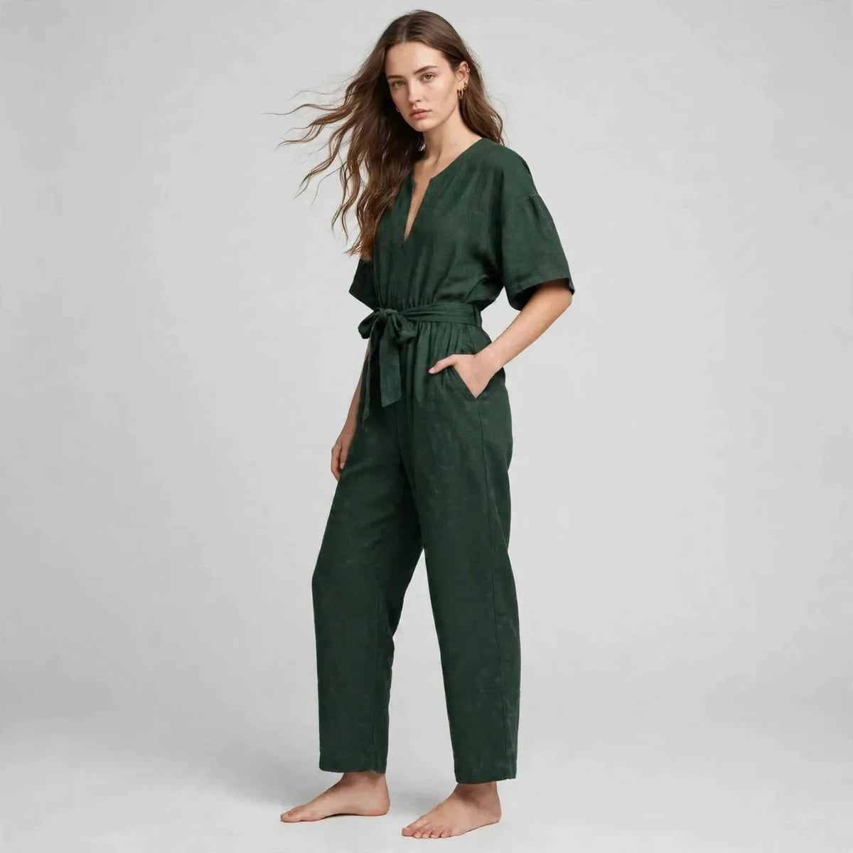 Women's dark green tie-waist jumpsuit, three-quarter view