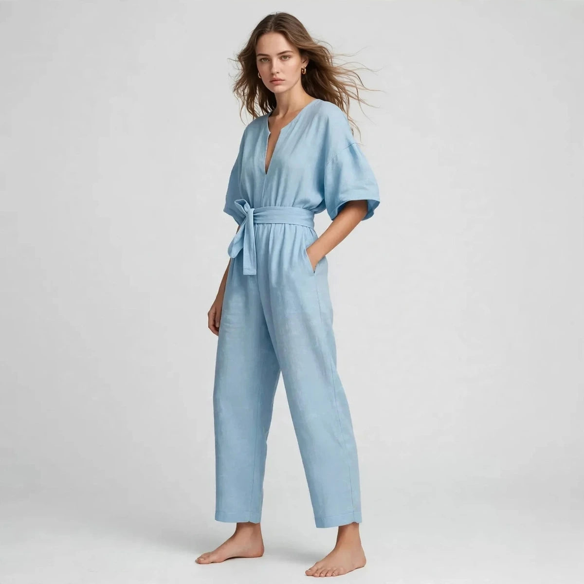 Women's sky blue tie-waist jumpsuit, three-quarter view