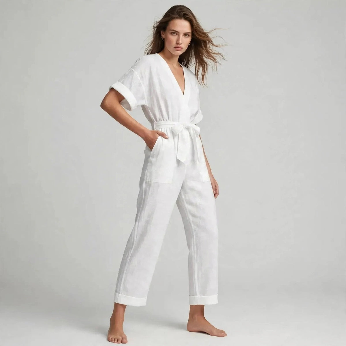 Women's white tie-waist jumpsuit, three-quarter view