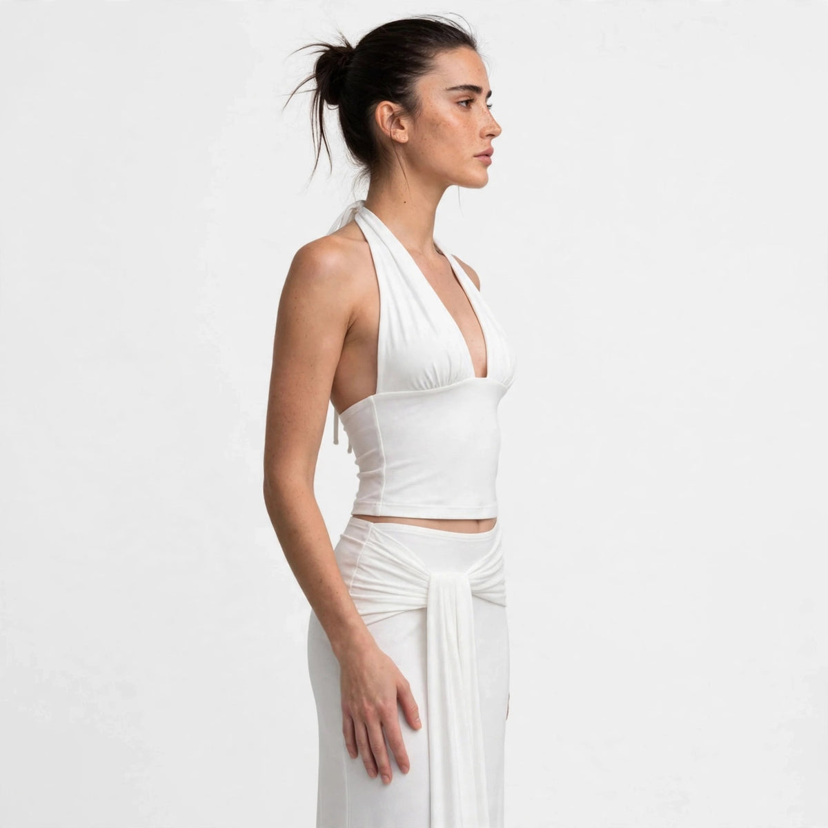 Back view of white halter top and draped maxi skirt set