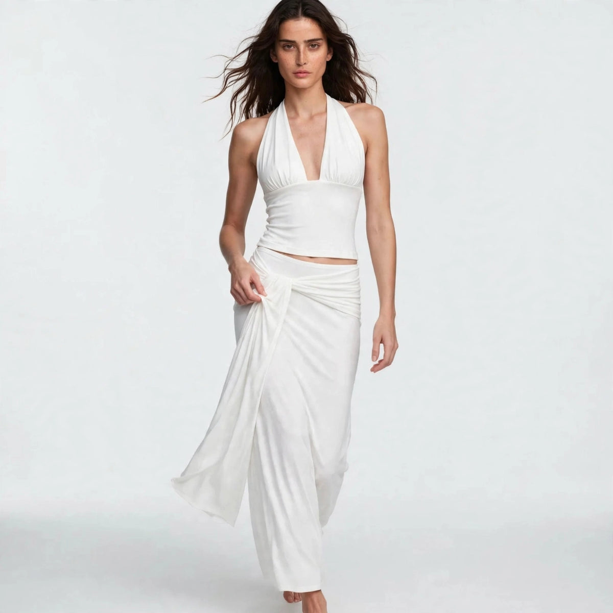 Side view of white halter skirt set with tie-back top