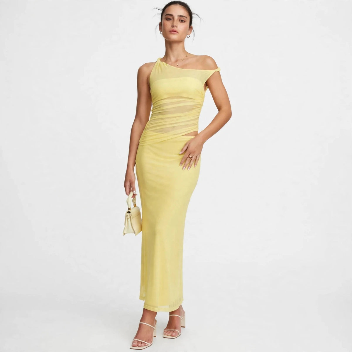 yellow asymmetrical cutout maxi dress – front view, hand on hip