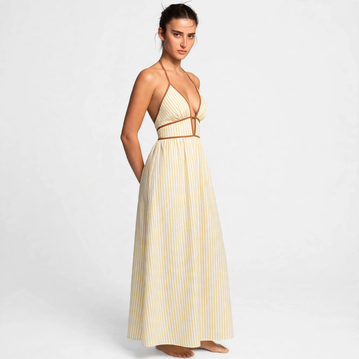 yellow striped halter maxi dress – front view, hands behind back
