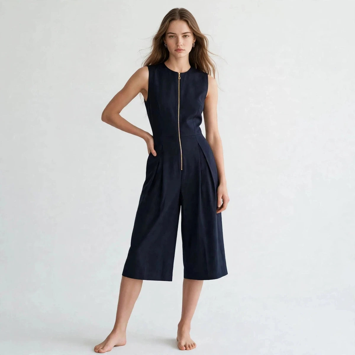 Women's dark blue jumpsuit with zipper pockets, front view